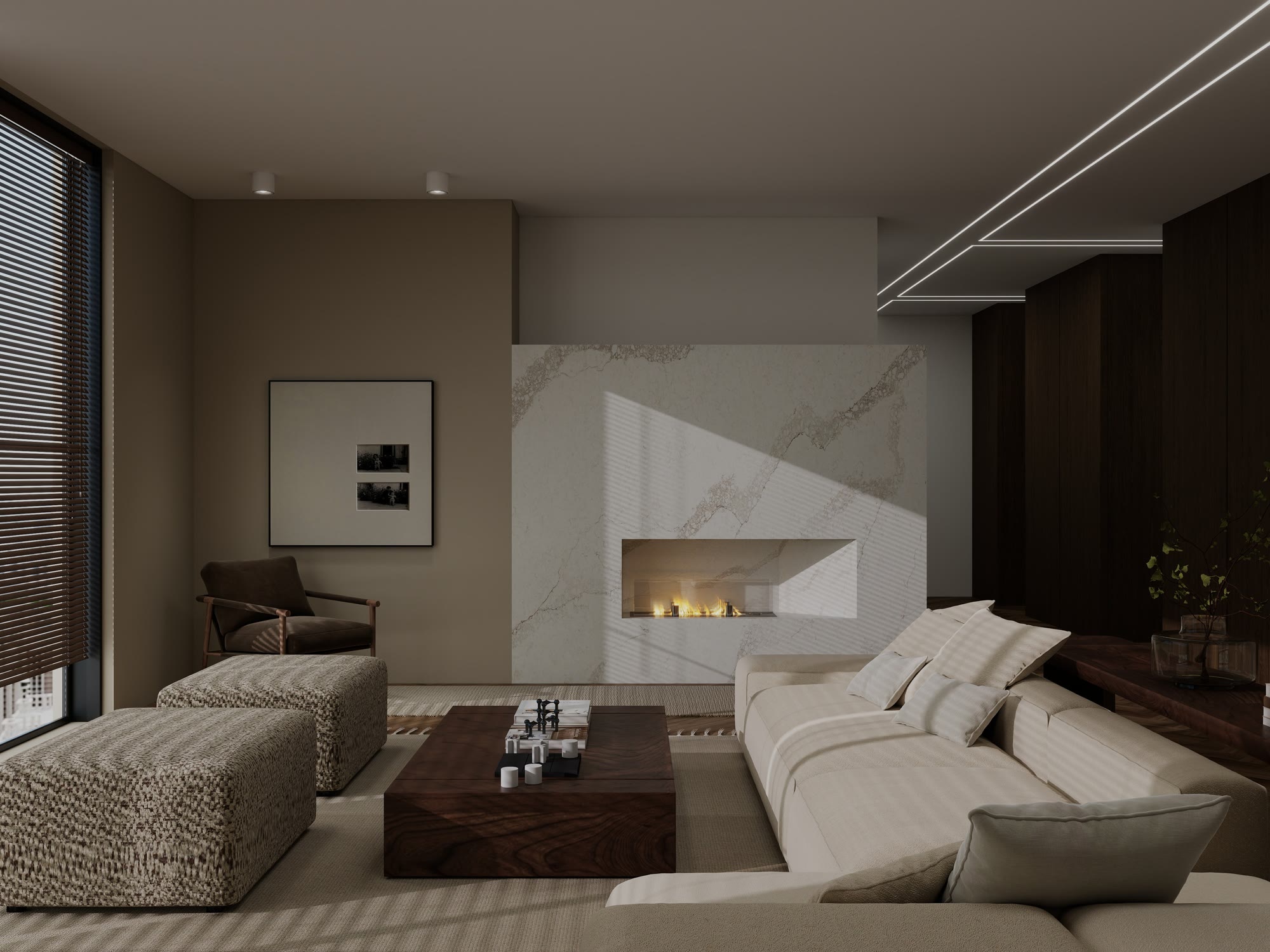 A living room designed by Nikola, with a veined stone fireplace, a walnut coffee table and a cream sofa